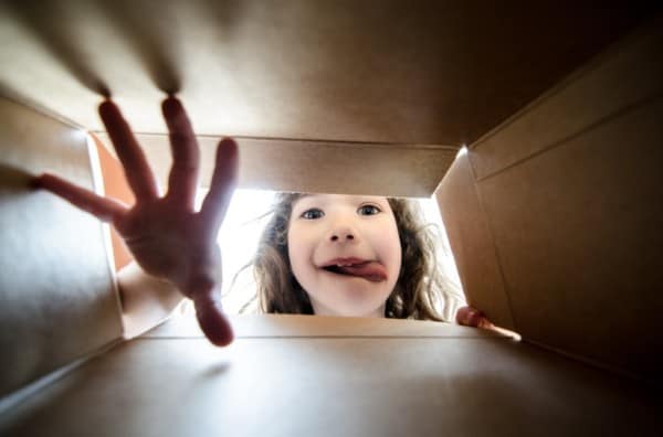 Child peeks into package